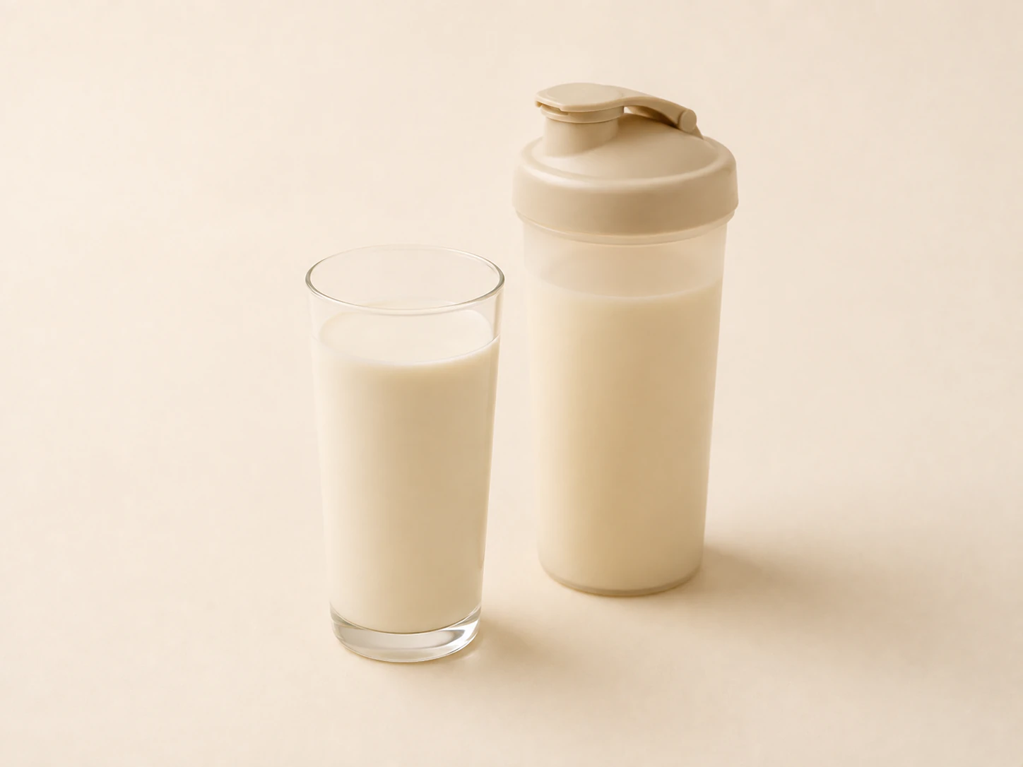 A creamy high-protein beverage and shaker illustrating typical whey protein isolate applications